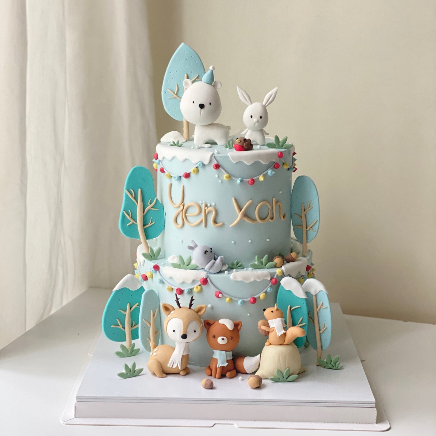 Adorable Animal Winter Wonderland Two-Tier Cake