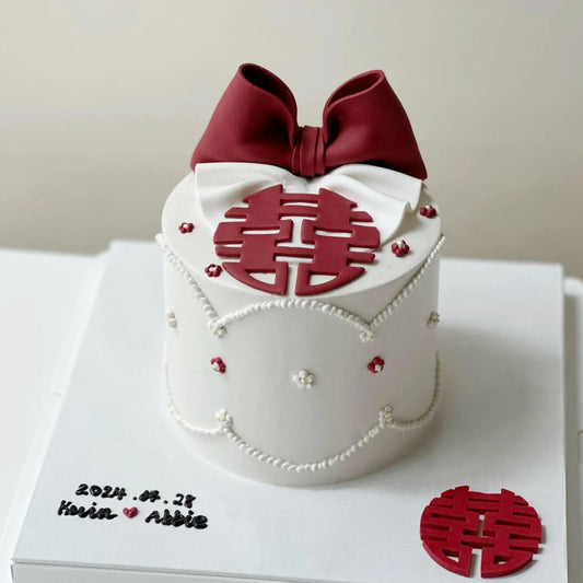 Red and white themed Chinese engagement cake