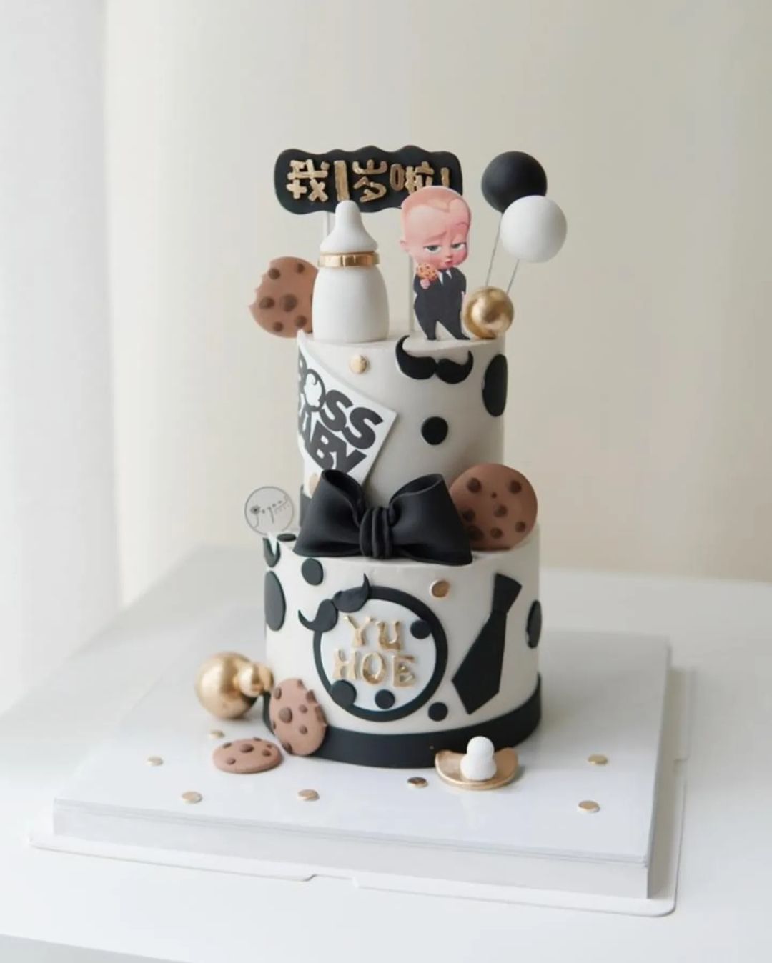 Baby Boss black white themed two-tier cake